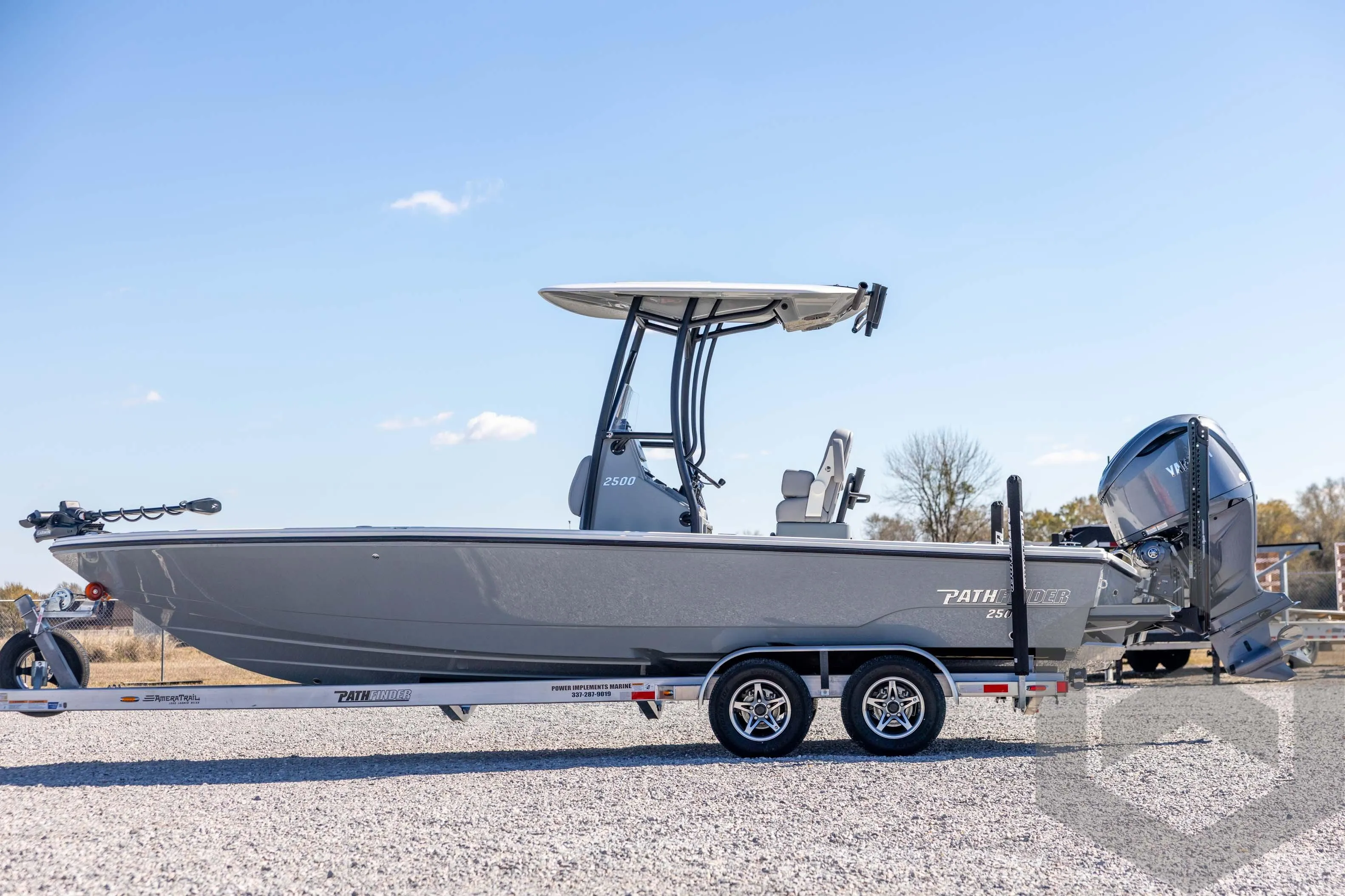 2026 Pathfinder 2500 Hybrid boat on trailer, side view, clear sky background.