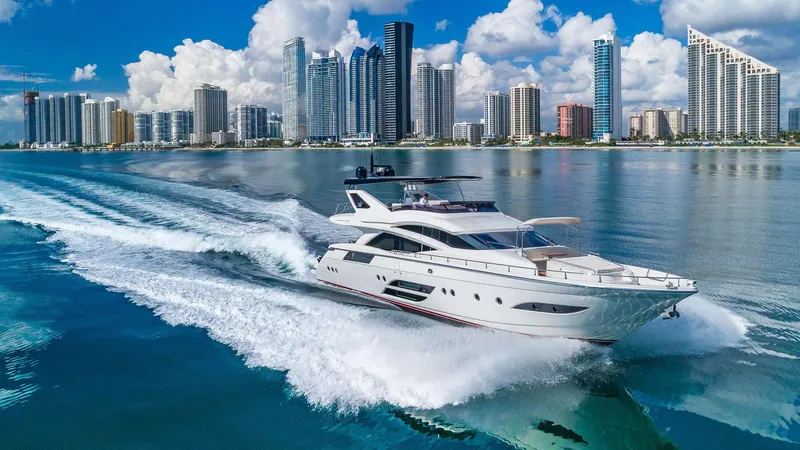 Golden 3 Yacht Photos Pics Luxurious 2015 Dominator 800 yacht cruising near a modern city skyline.
