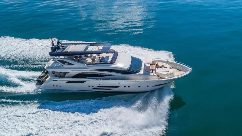 Golden 3 Yacht Photos Pics Luxurious 2015 Dominator 800 yacht cruising on clear blue waters.