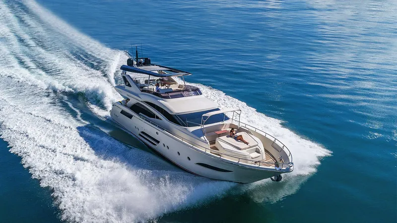 Golden 3 Yacht Photos Pics Luxurious 2015 Dominator 800 yacht cruising on open blue waters.