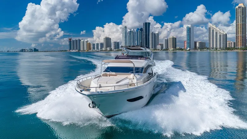 Golden 3 Yacht Photos Pics Luxury Dominator 800 yacht cruising near city skyline, 2015 model.
