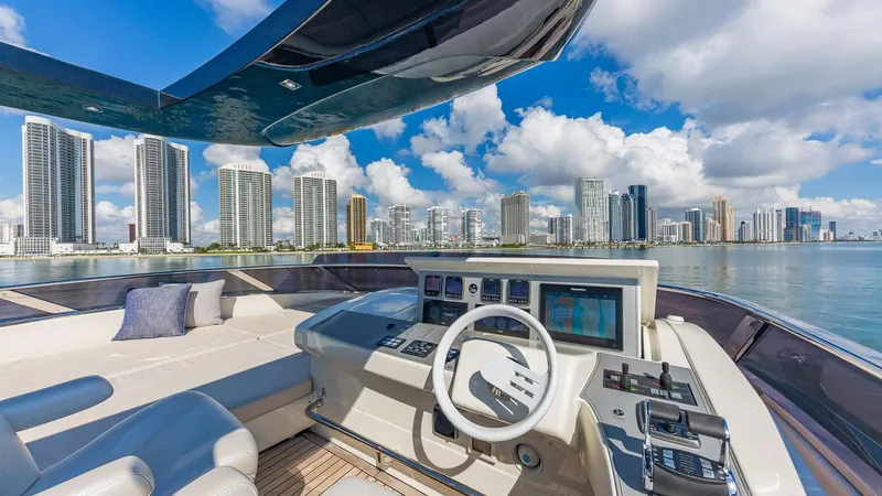 Golden 3 Yacht Photos Pics Luxurious 2015 Dominator 800 yacht helm with city skyline view.