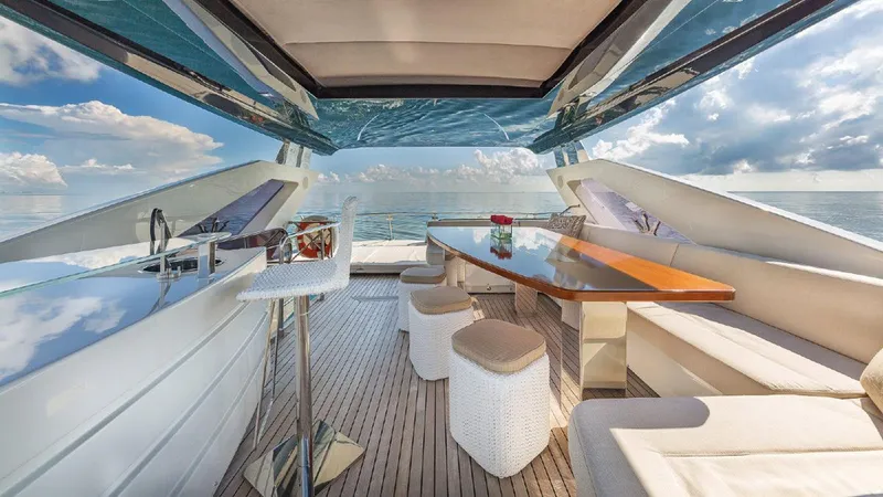 Golden 3 Yacht Photos Pics Luxurious 2015 Dominator 800 yacht interior with elegant seating and ocean view.