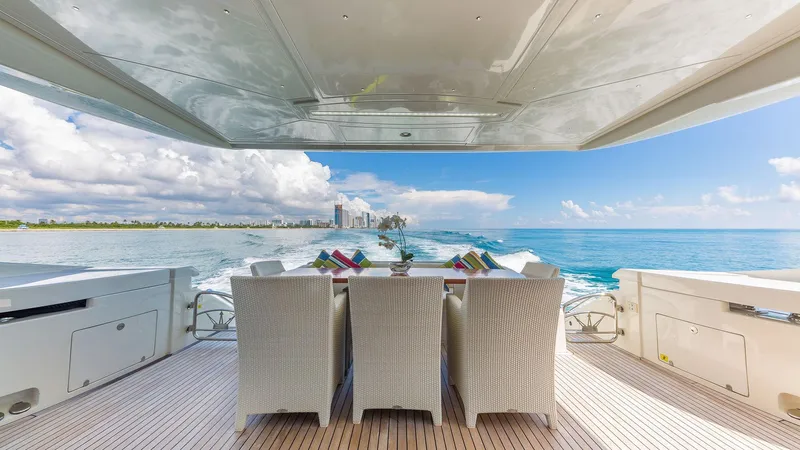 Golden 3 Yacht Photos Pics Luxury yacht Dominator 800, 2015 model, with elegant outdoor dining area and ocean view.