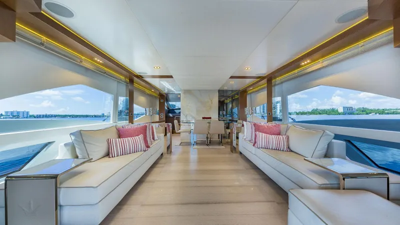 Golden 3 Yacht Photos Pics Luxurious interior of 2015 Dominator 800 yacht with elegant seating and panoramic windows.