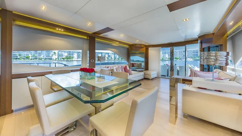 Golden 3 Yacht Photos Pics Luxurious interior of 2015 Dominator 800 yacht with modern dining and seating area.