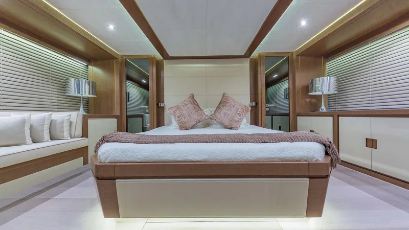 Golden 3 Yacht Photos Pics Luxurious bedroom interior of 2015 Dominator 800 yacht with modern decor and ambient lighting.