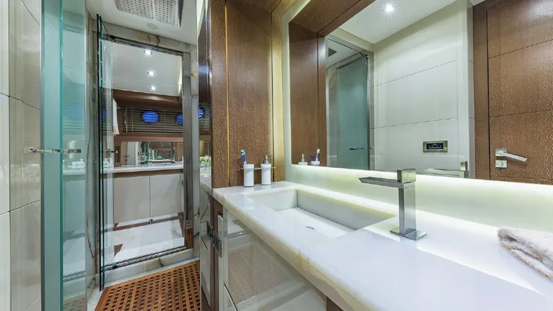 Golden 3 Yacht Photos Pics Luxurious bathroom in 2015 Dominator 800 yacht with modern fixtures and elegant design.