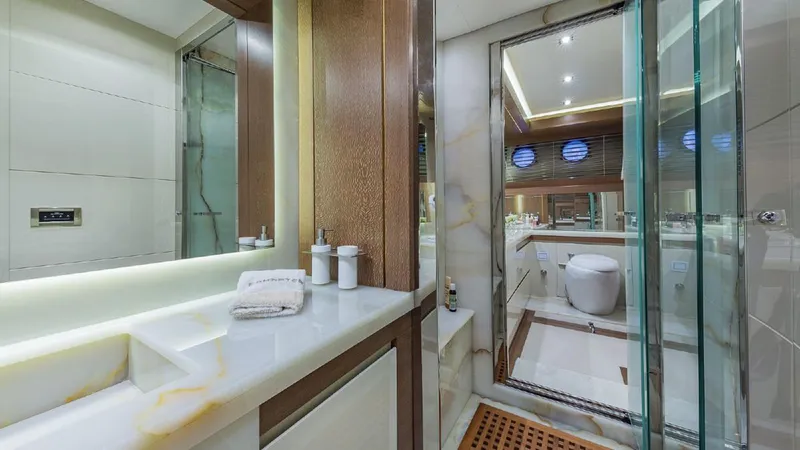 Golden 3 Yacht Photos Pics Luxurious yacht bathroom with modern fixtures, glass shower, and elegant wood accents, Dominator 800, 2015.