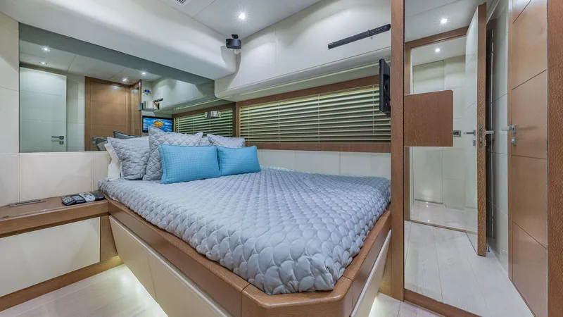 Golden 3 Yacht Photos Pics Luxurious bedroom interior of 2015 Dominator 800 yacht with modern design and cozy bedding.