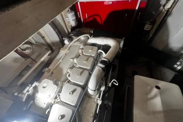 North Star Yacht Photos Pics Engine room of a 1984 Grand Banks Trawler, showcasing mechanical components and piping.