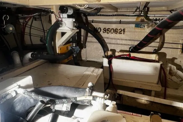 North Star Yacht Photos Pics Engine room of 1984 Grand Banks Trawler with visible pipes and equipment.