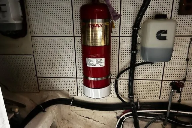 North Star Yacht Photos Pics Engine room of 1984 Grand Banks Trawler with fire extinguisher and wiring.