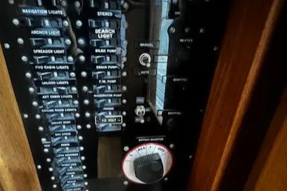 North Star Yacht Photos Pics Control panel of a 1984 Grand Banks Trawler with various switches and dials.