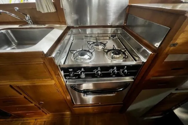 North Star Yacht Photos Pics 1984 Grand Banks Trawler kitchen with stainless steel stove and sink.