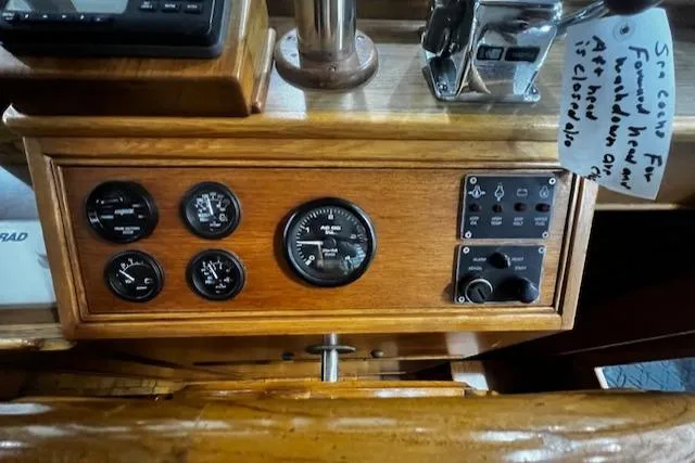 North Star Yacht Photos Pics 1984 Grand Banks Trawler dashboard with gauges and controls in wooden panel.