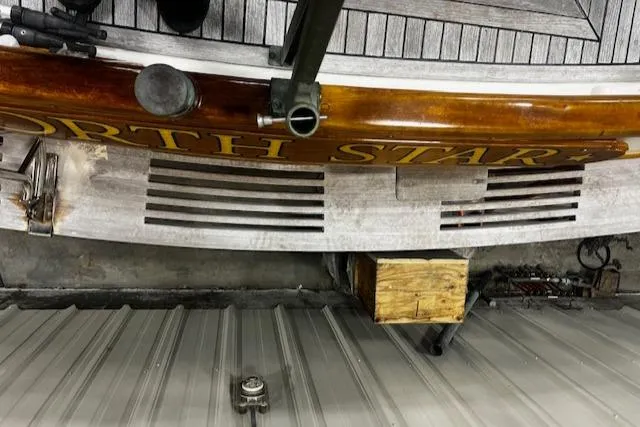 North Star Yacht Photos Pics 1984 Grand Banks Trawler stern with "North Star" lettering, wooden deck, and metal fittings.