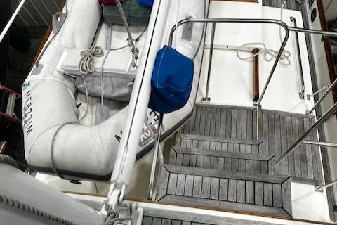 North Star Yacht Photos Pics 1984 Grand Banks Trawler deck with inflatable dinghy and wooden steps.