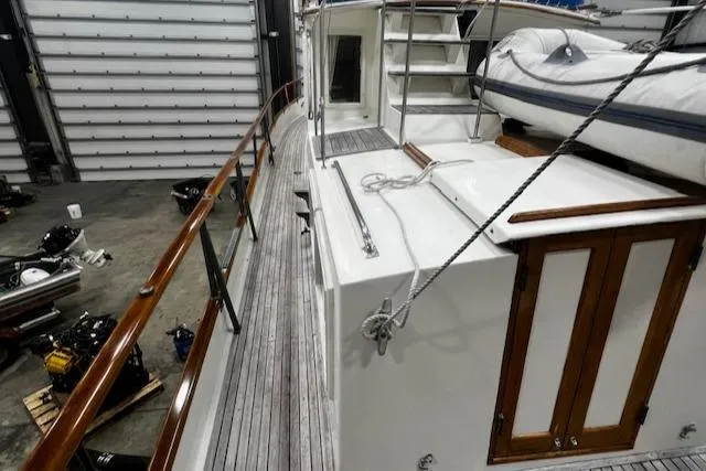 North Star Yacht Photos Pics 1984 Grand Banks Trawler in a workshop, showcasing deck and railing details.