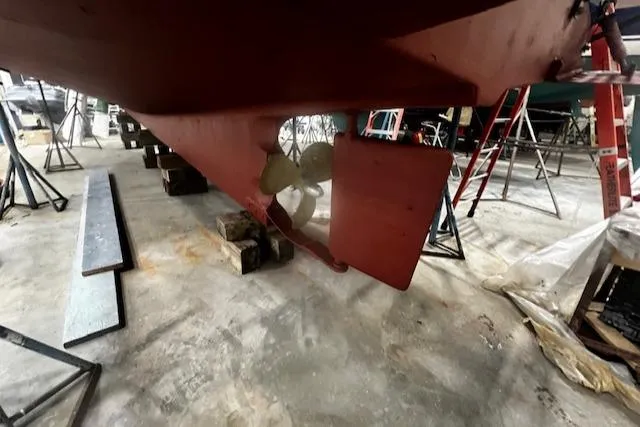 North Star Yacht Photos Pics 1984 Grand Banks Trawler propeller and rudder in a boatyard setting.