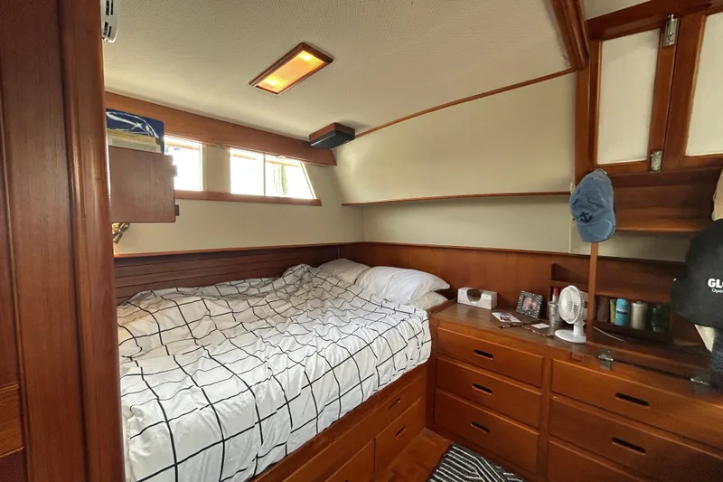 Yacht Photos Pics Cozy cabin interior of 1988 Grand Banks 42 Classic yacht with wooden furnishings.