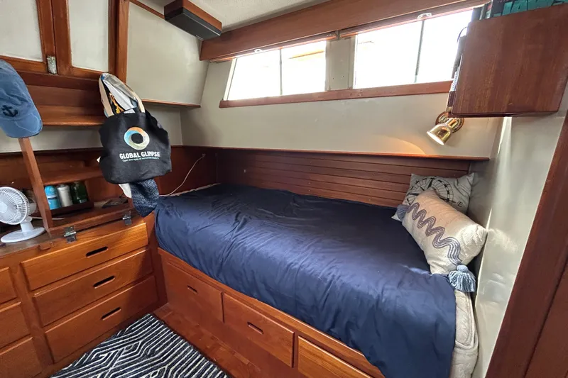  Yacht Photos Pics Cozy cabin interior of 1988 Grand Banks 42 Classic yacht with wooden furnishings.