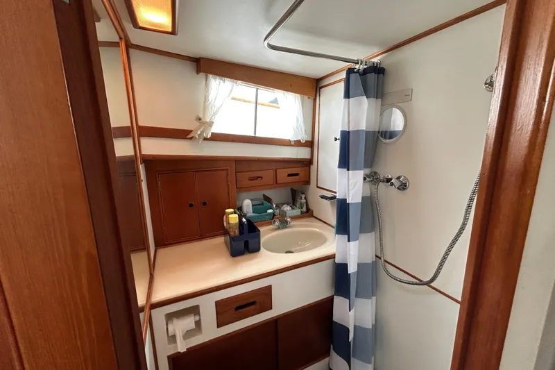  Yacht Photos Pics Bathroom interior of 1988 Grand Banks 42 Classic yacht with shower and sink.