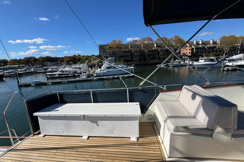  Yacht Photos Pics 1988 Grand Banks 42 Classic yacht deck with marina view, featuring seating and storage.