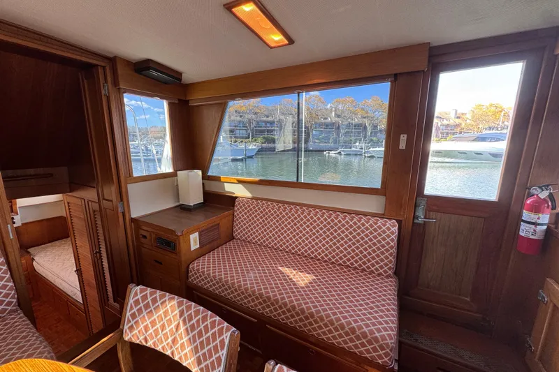  Yacht Photos Pics Interior of 1988 Grand Banks 42 Classic yacht with wood finish and waterfront view.