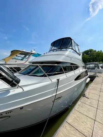 "kimberly Cay" Yacht Photos Pics 2003 Carver 360 Sport Sedan docked under clear blue sky.