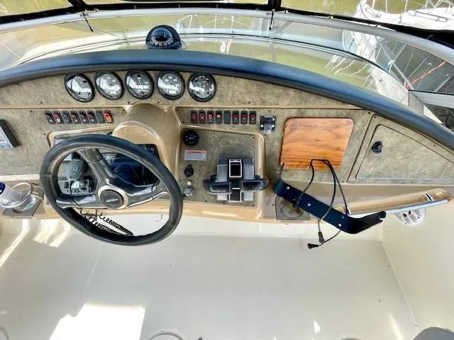 "kimberly Cay" Yacht Photos Pics 2003 Carver 360 Sport Sedan dashboard with steering wheel and instrument panel.