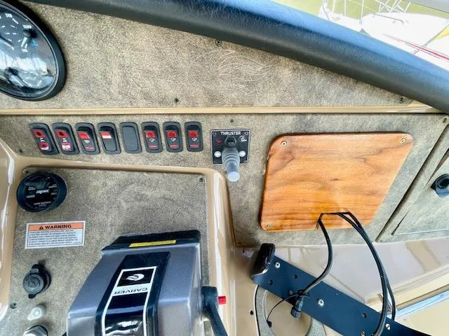 "kimberly Cay" Yacht Photos Pics Control panel of a 2003 Carver 360 Sport Sedan boat with switches and thruster controls.