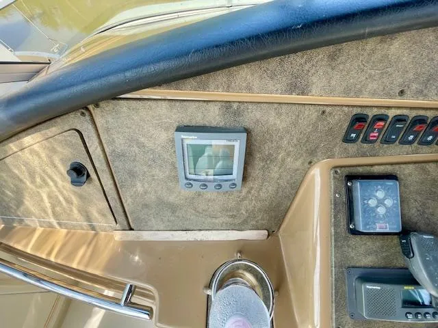 "kimberly Cay" Yacht Photos Pics Control panel of a 2003 Carver 360 Sport Sedan boat, featuring navigation and control switches.