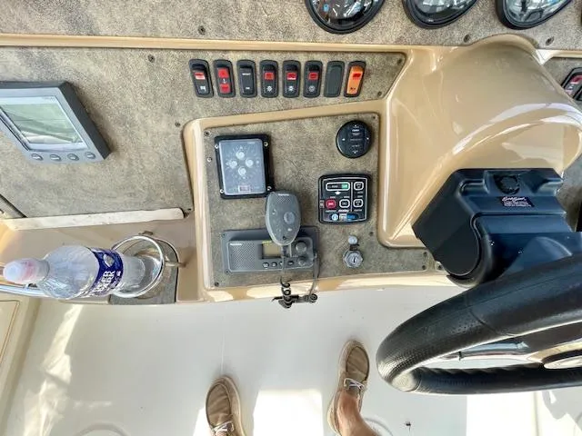 "kimberly Cay" Yacht Photos Pics Control panel of a 2003 Carver 360 Sport Sedan with various gauges and switches.