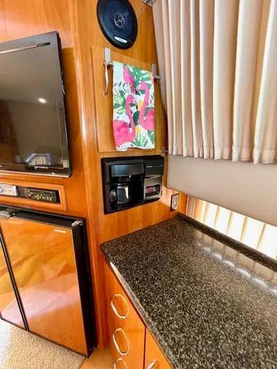 "kimberly Cay" Yacht Photos Pics Interior of 2003 Carver 360 Sport Sedan with kitchenette, TV, and coffee maker.