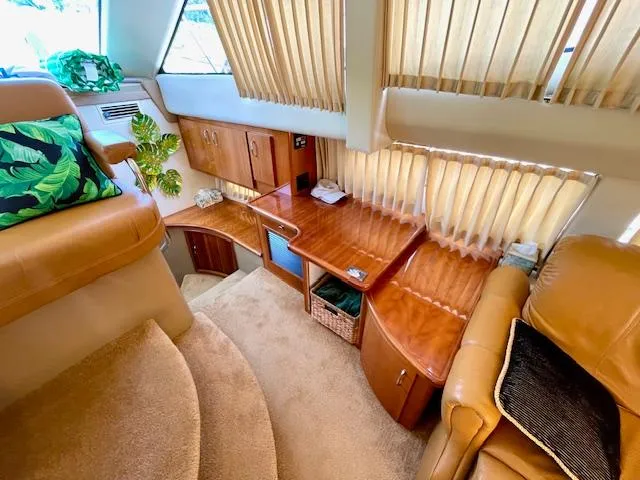 "kimberly Cay" Yacht Photos Pics Luxurious interior of 2003 Carver 360 Sport Sedan with wood accents and plush seating.