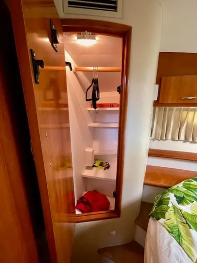 "kimberly Cay" Yacht Photos Pics 2003 Carver 360 Sport Sedan interior closet with shelves and hangers.