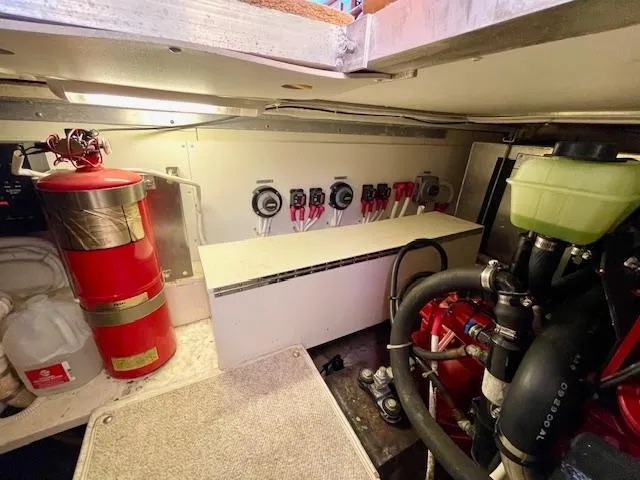 "kimberly Cay" Yacht Photos Pics Engine room of a 2003 Carver 360 Sport Sedan with fire extinguisher and control panel.