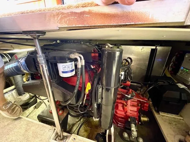 "kimberly Cay" Yacht Photos Pics Engine compartment of a 2003 Carver 360 Sport Sedan, showcasing mechanical components and wiring.