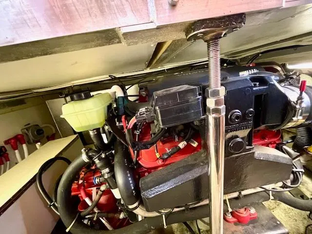 "kimberly Cay" Yacht Photos Pics Engine compartment of a 2003 Carver 360 Sport Sedan, showcasing mechanical components and wiring.