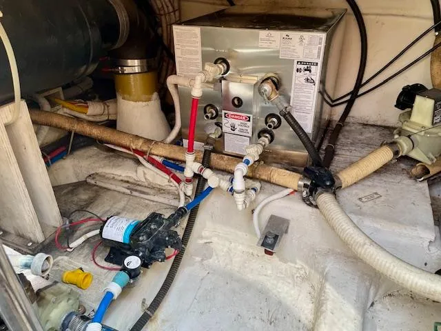 "kimberly Cay" Yacht Photos Pics Engine room of a 2003 Carver 360 Sport Sedan with plumbing and equipment.