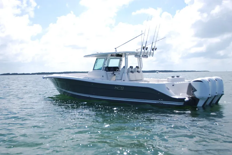  Yacht Photos Pics 2019 HCB 39 Speciale boat on calm water under a cloudy sky.