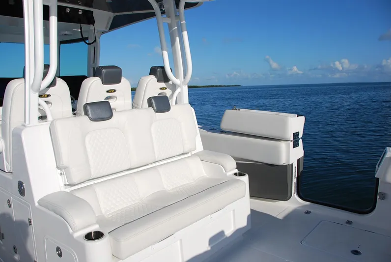 Yacht Photos Pics 2019 HCB 39 Speciale boat interior with white seating, ocean view in background.