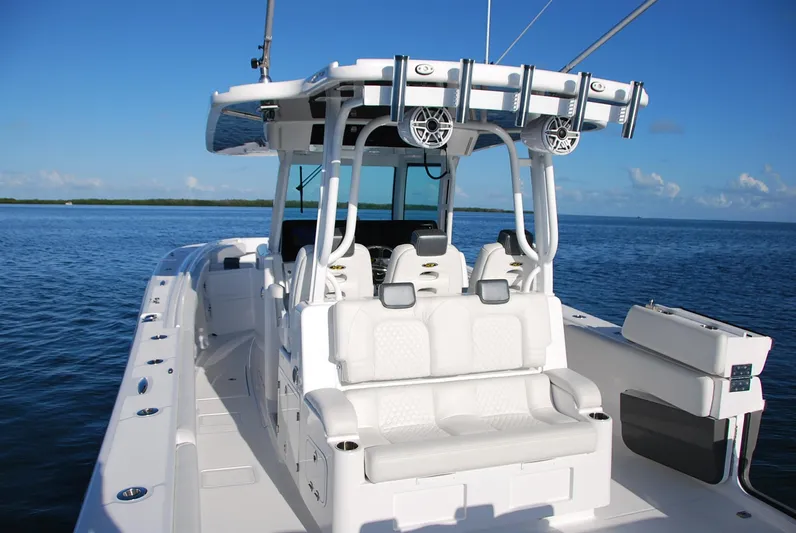  Yacht Photos Pics 2019 HCB 39 Speciale boat on calm blue water, featuring sleek white seating and modern design.