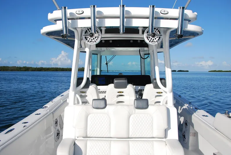  Yacht Photos Pics 2019 HCB 39 Speciale boat interior with white seating, ocean backdrop.