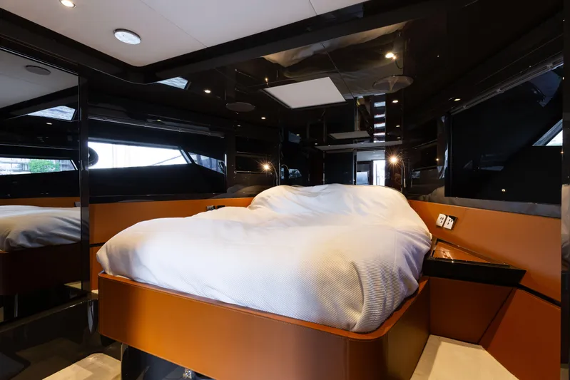  Yacht Photos Pics Luxurious bedroom interior of 2022 Riva Dolceriva yacht with modern design and cozy bedding.
