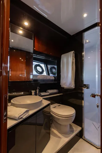  Yacht Photos Pics Luxurious bathroom in 2022 Riva Dolceriva yacht with modern fixtures and elegant design.