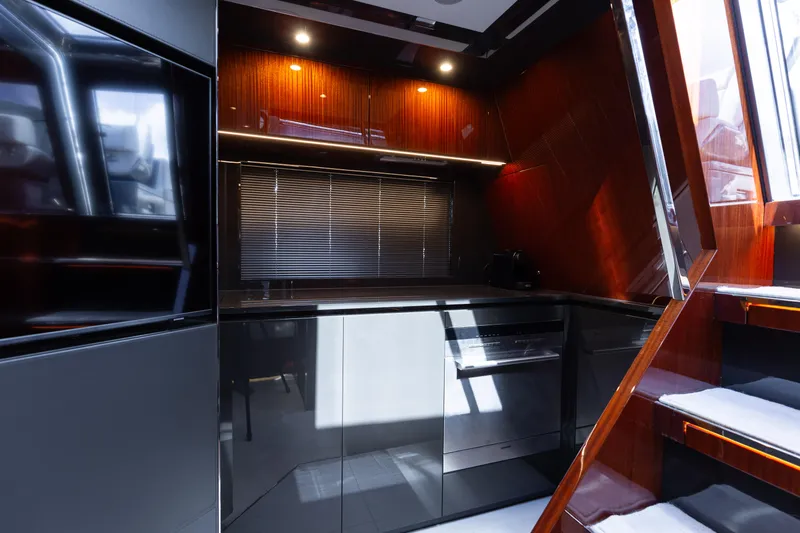  Yacht Photos Pics Luxurious 2022 Riva Dolceriva yacht interior with modern kitchen design and sleek cabinetry.