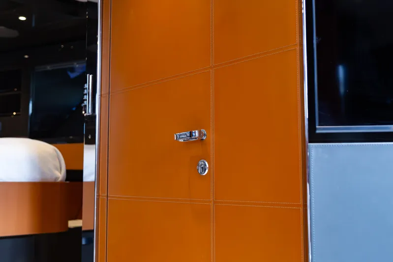  Yacht Photos Pics Interior view of 2022 Riva Dolceriva yacht with sleek orange door design.