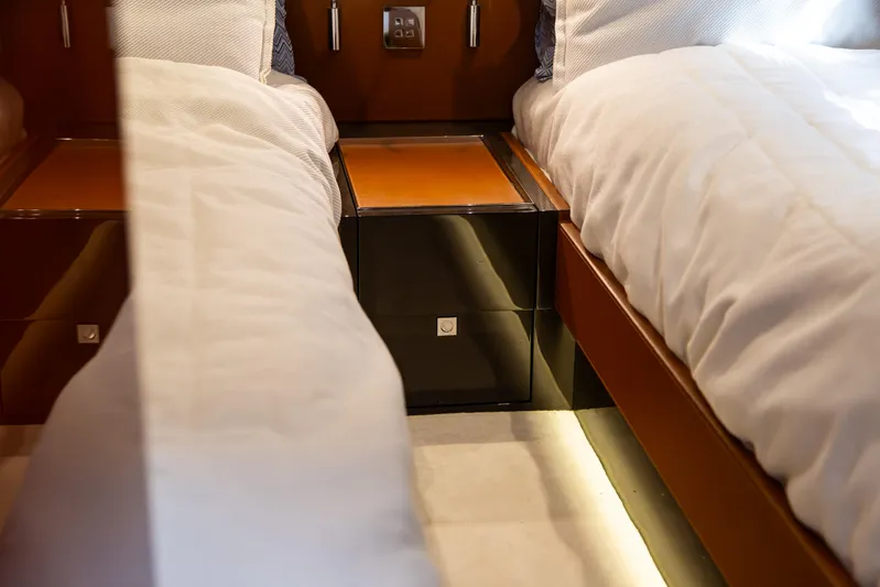  Yacht Photos Pics Luxurious interior of 2022 Riva Dolceriva yacht with twin beds and elegant design.